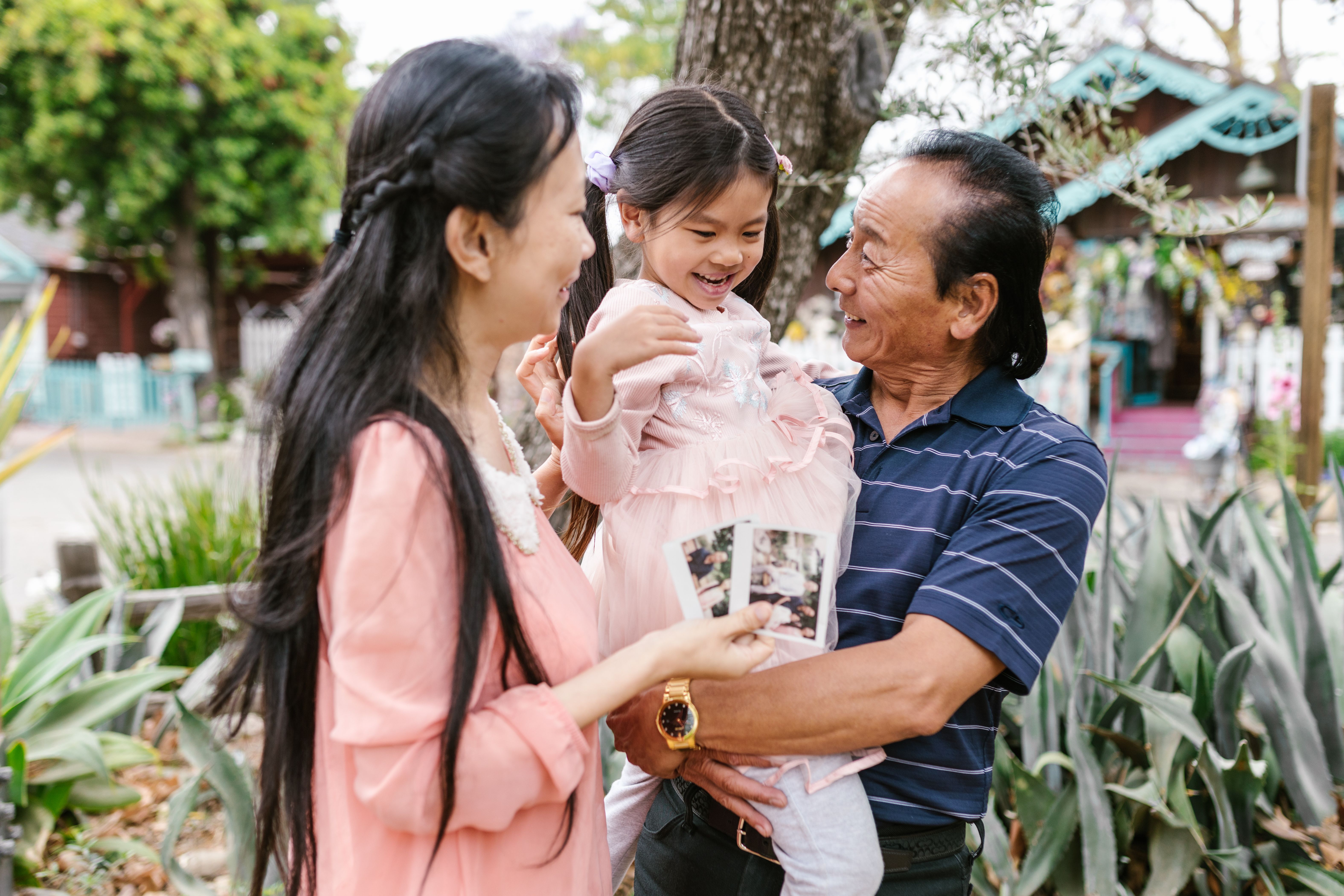 Grandfather with family outdoors